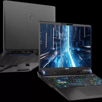 Computador portátil MSI cinza escuro com ecrã aberto e teclado colorido, fundo preto