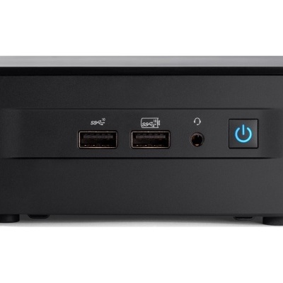 Mini PC preto com duas portas USB, entrada áudio e botão de ligar