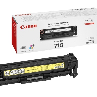 Cartucho toner amarelo Canon 718 com caixa à sua frente.