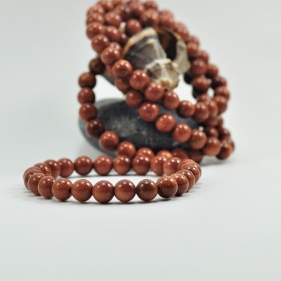 Pulseira de bolas pedra sol/ouro