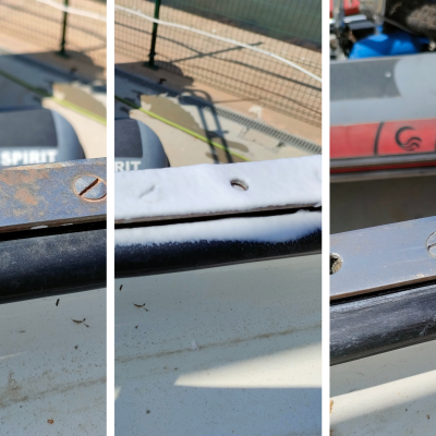 Barco cinzento com textos Ocean Spirit e Ocean 1009 e detalhes metálicos enferrujados