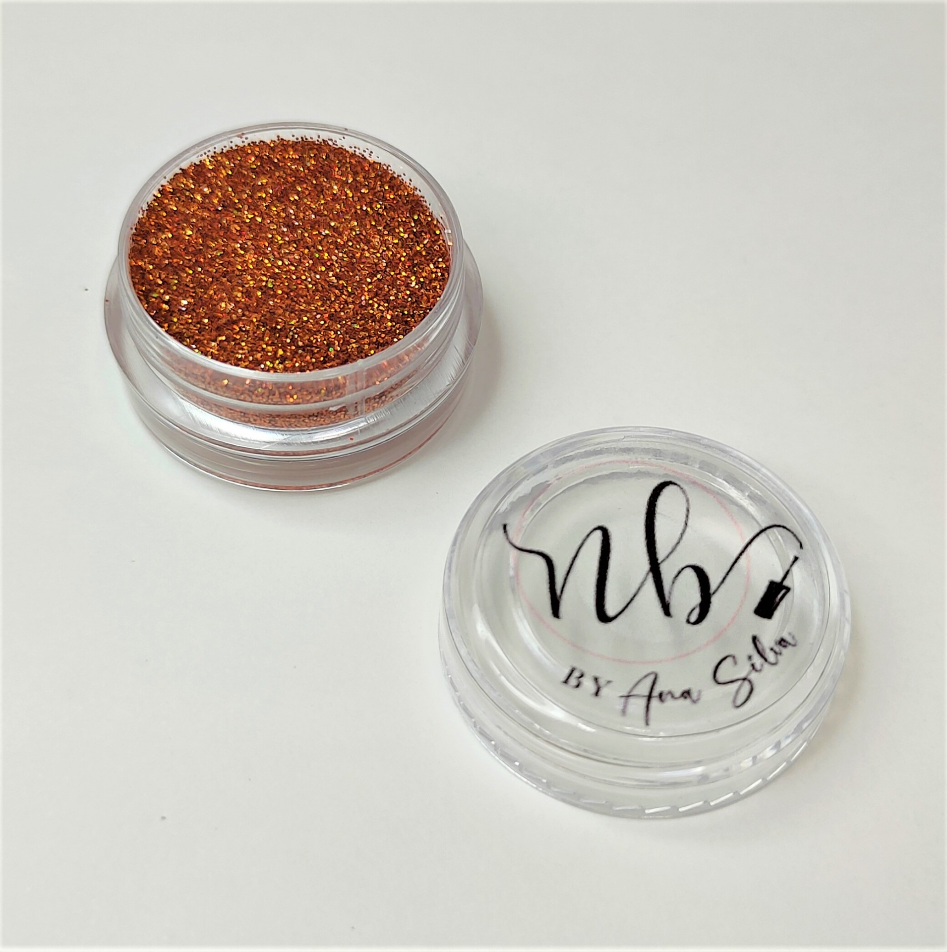 Pote transparente com glitter laranja e tampa com texto nb BY Ana Silva