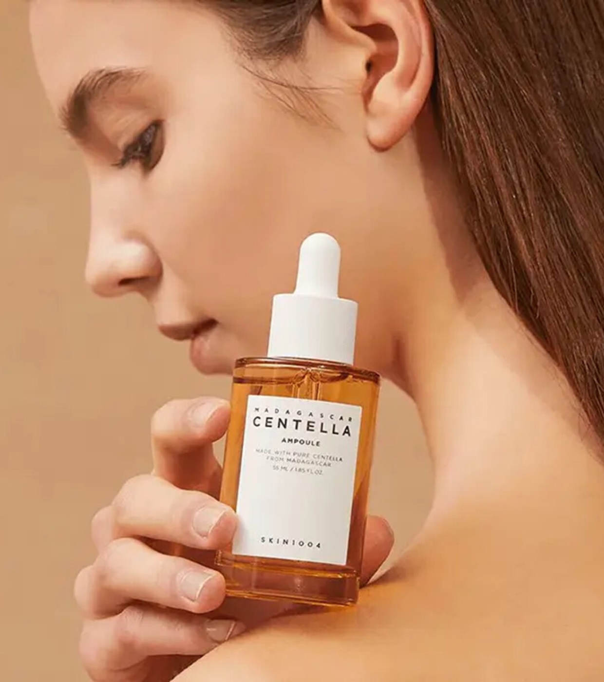 Frasco âmbar com conta-gotas branco de sérum Madagascar Centella