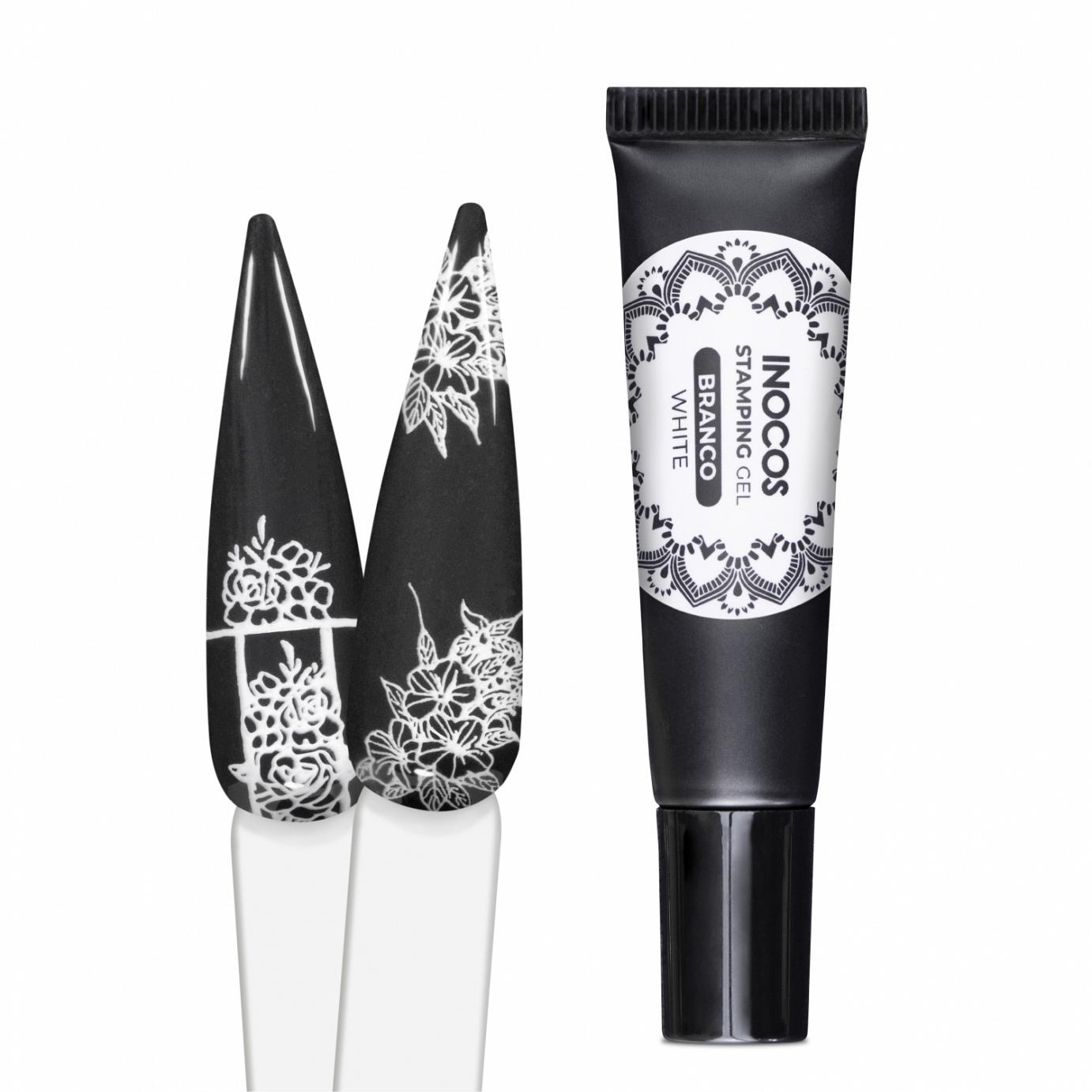 Tube de tinta branca para carimbo e unhas decoradas com padrão floral branco e preto