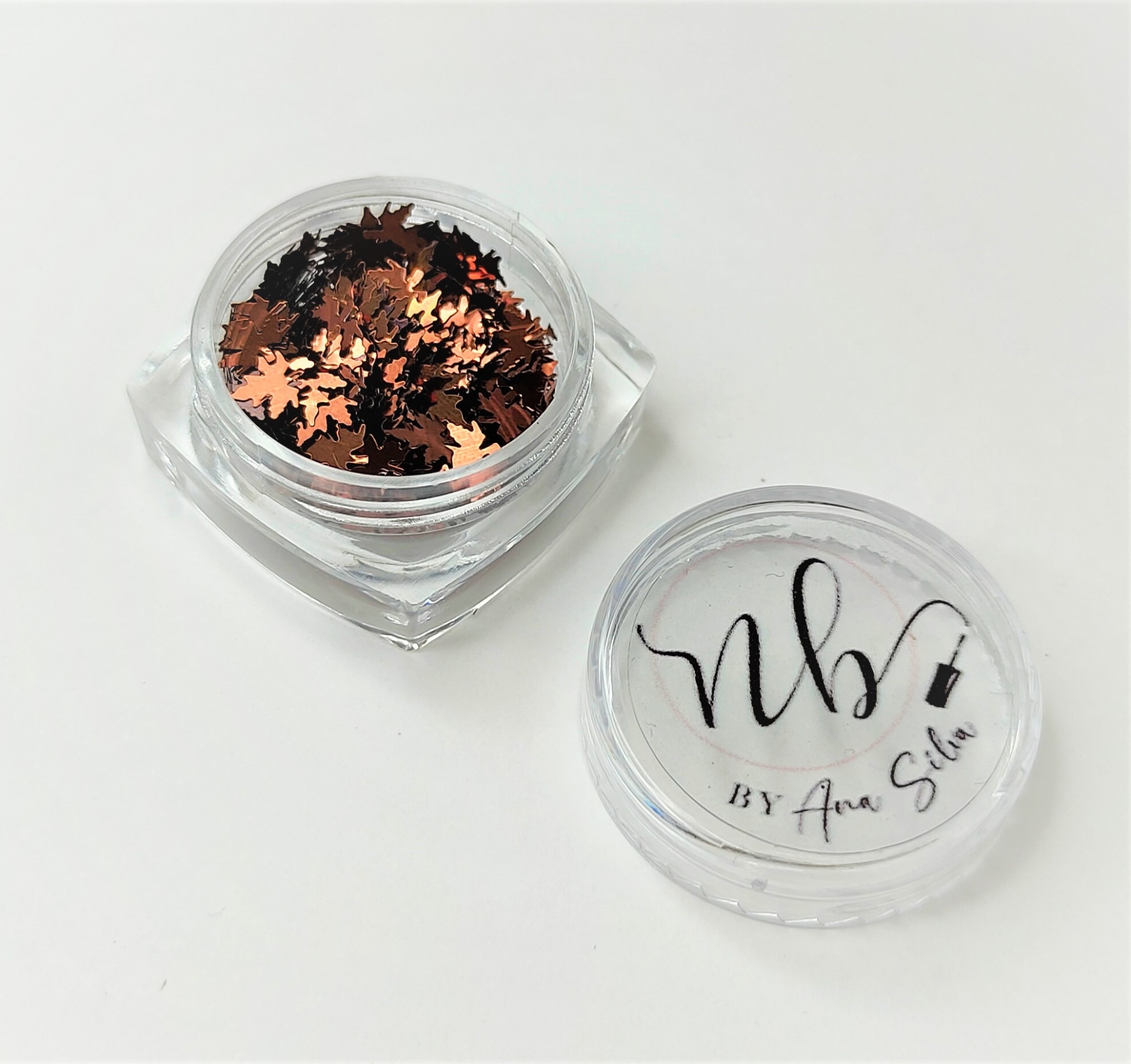 Pote com glitter em forma de folhas metálicas cobre e tampa com texto nbj BY Ana Silva