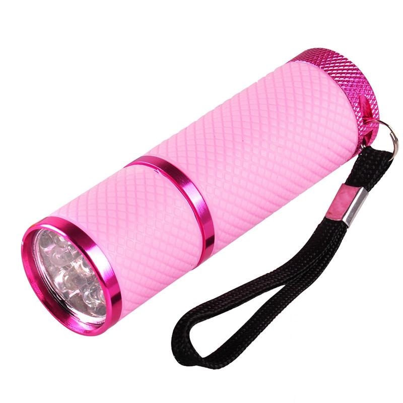 Lanterna portátil rosa com pulseira preta e corpo texturizado
