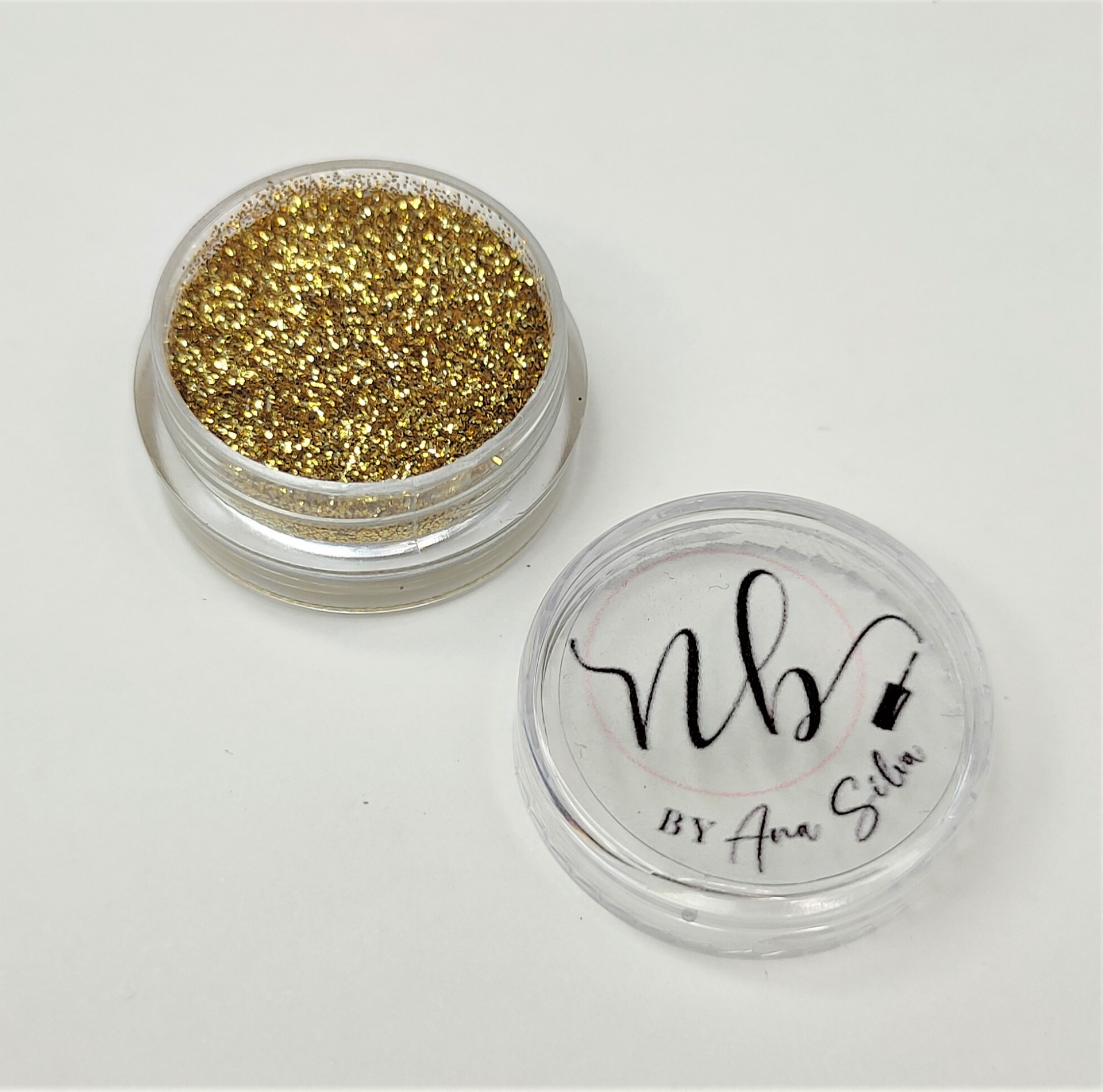 Pote de glitter dourado com tampa transparente com texto nb BY Ana Silva