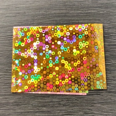 Papel autocolante holográfico com padrão de círculos coloridos