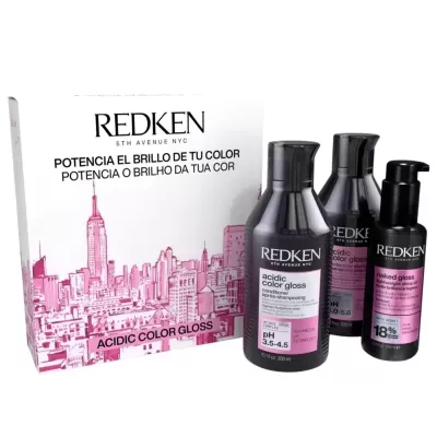 Conjunto de produtos para cabelo Redken Acidic Color Gloss com embalagem branca ilustrada e produtos em frascos pretos com rótulos rosa.