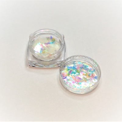 Pote pequeno com glitter iridescente flocos coloridos