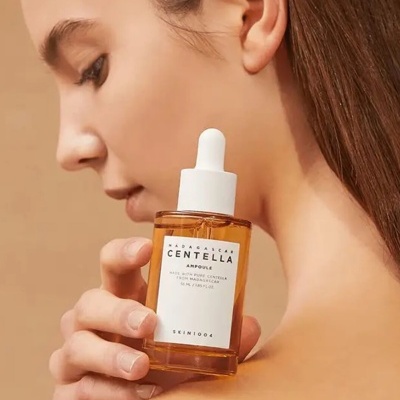 Frasco âmbar com conta-gotas branco de sérum Madagascar Centella