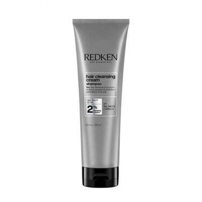 Frasco de shampoo Redken hair cleansing cream prateado com texto e tampa preta