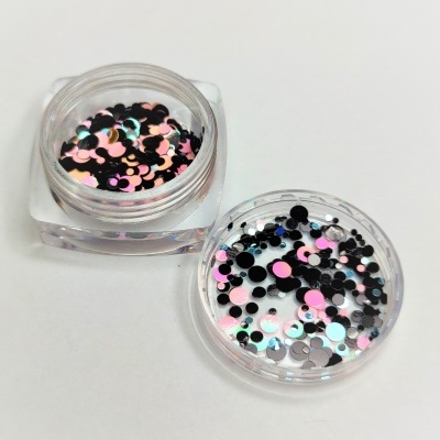 Pequena embalagem transparente com confetes coloridos redondos