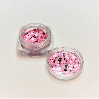 Frasco pequeno com purpurina rosa e branca com tampa ao lado sobre fundo claro