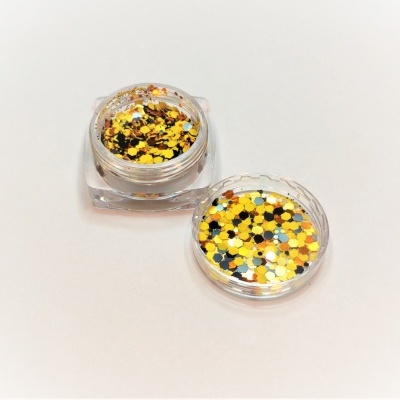 Pote transparente com purpurinas coloridas amarelas, douradas, brancas e pretas