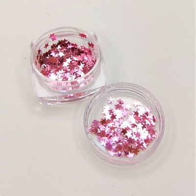 Frascos transparentes com lantejoulas rosa em forma de estrela