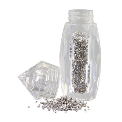 Frasco transparente com purpurina prateada e tampa facetada