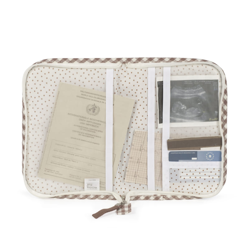 Organizer fabric pouch with brown dots and checkered edge holding documents and ultrasound picture