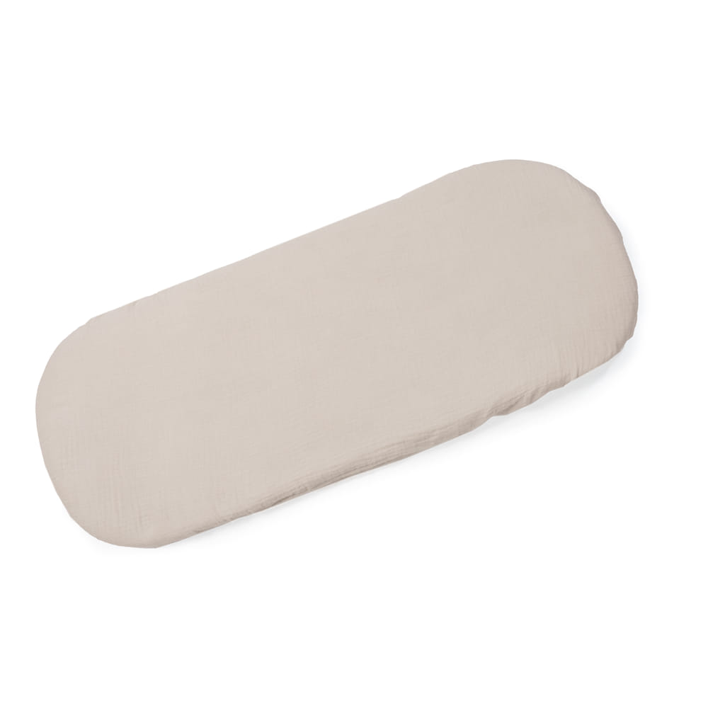 Colchão oval bege claro para bebê