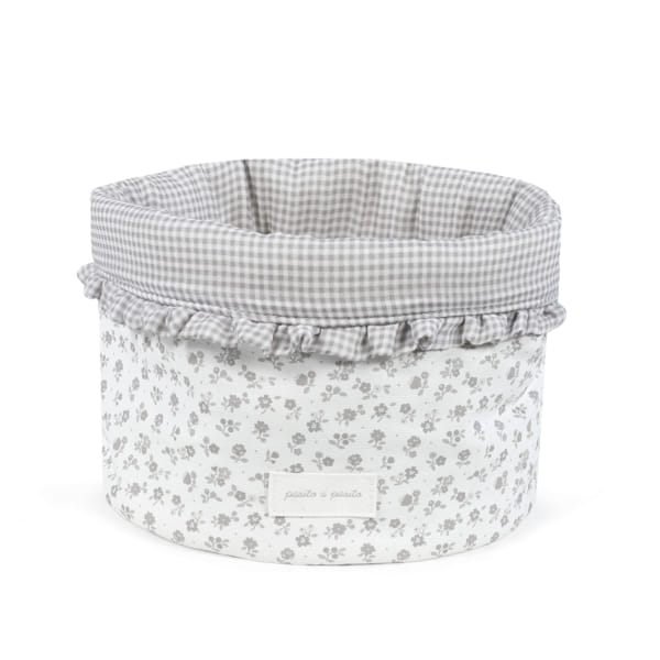 cesto redondo em tecido com padrão floral cinzento e interior xadrez