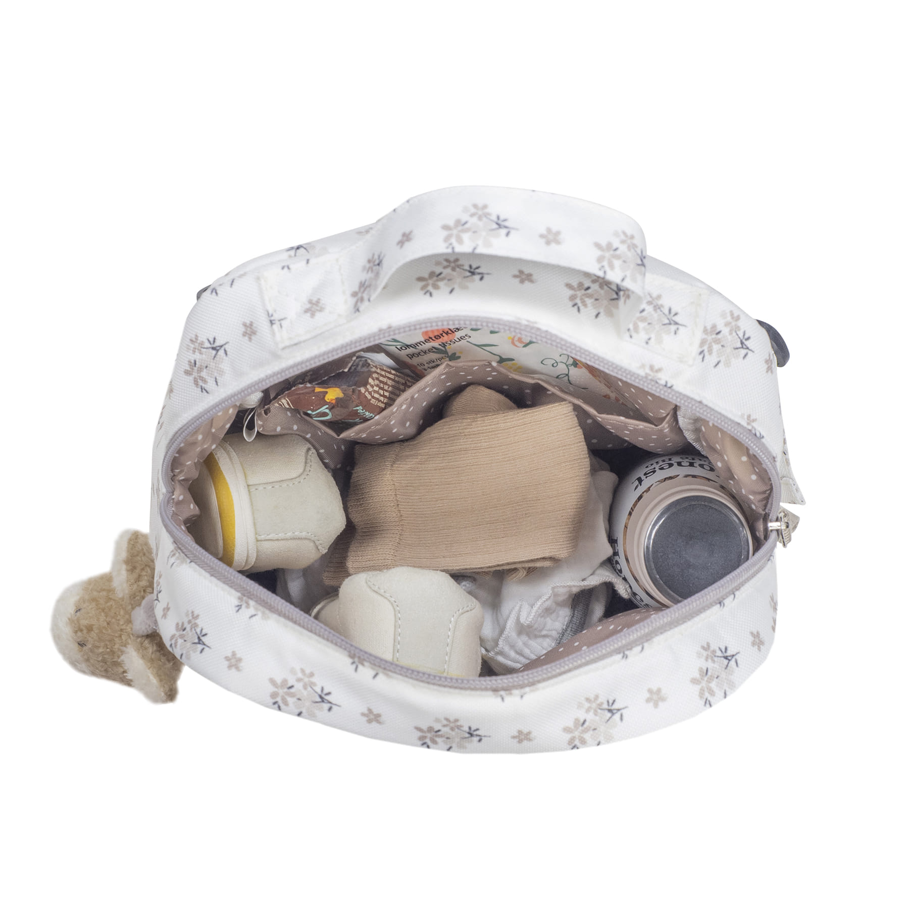 Bolsa branca com padrão floral e interior com vários itens visíveis