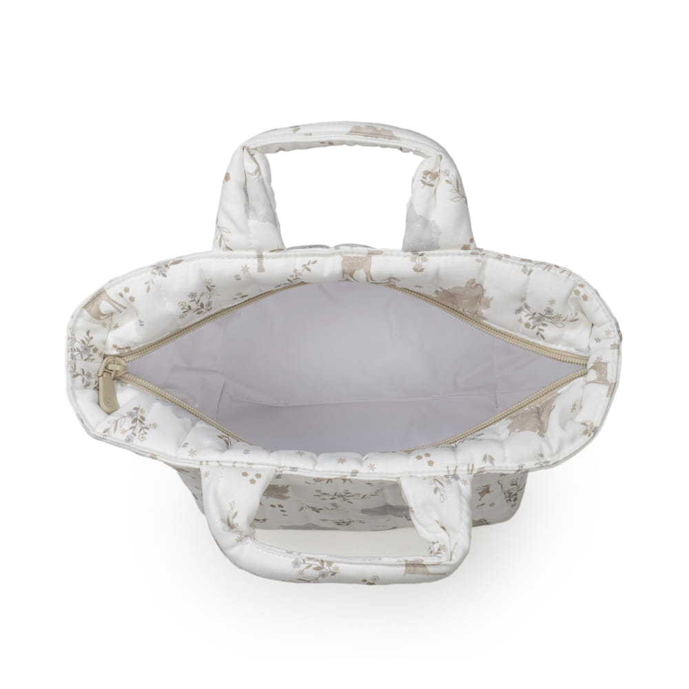 Mala de mão branca com padrão floral e interior cinzento aberto vista de cima