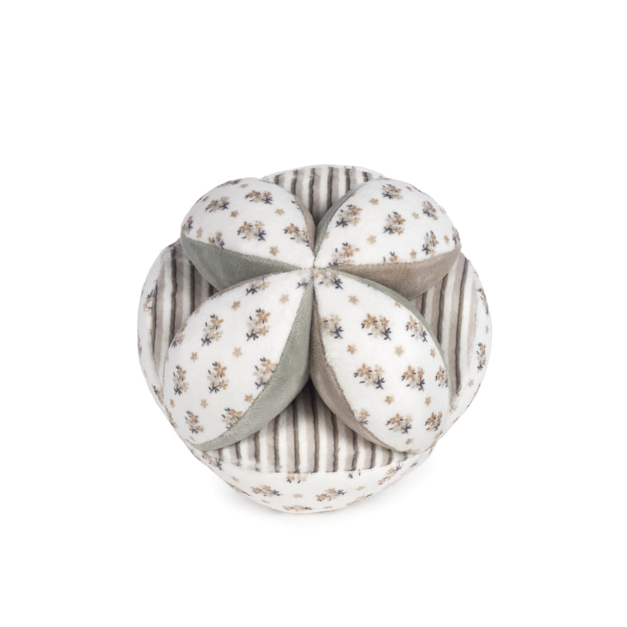 pufe redondo com almofadas florais e textura riscada