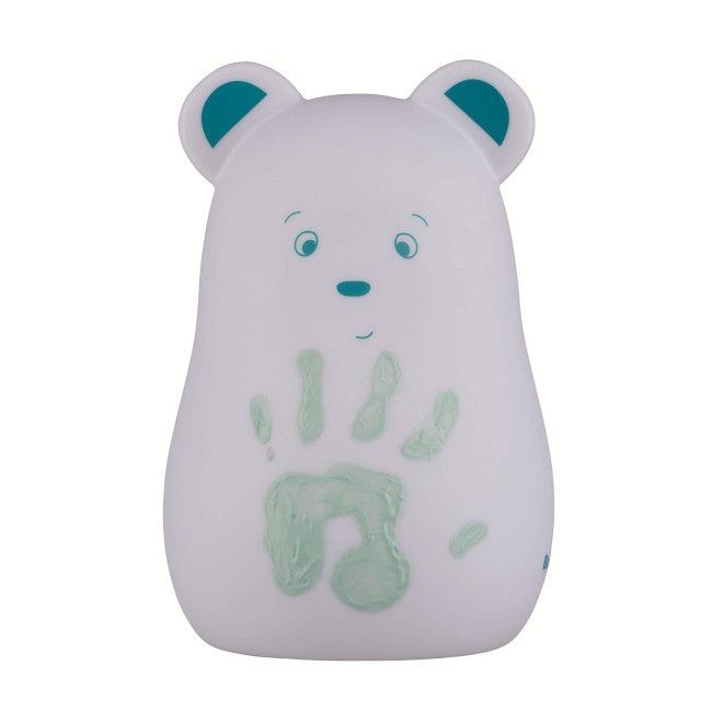 Urso branco com orelhas azuis e mão verde na frente