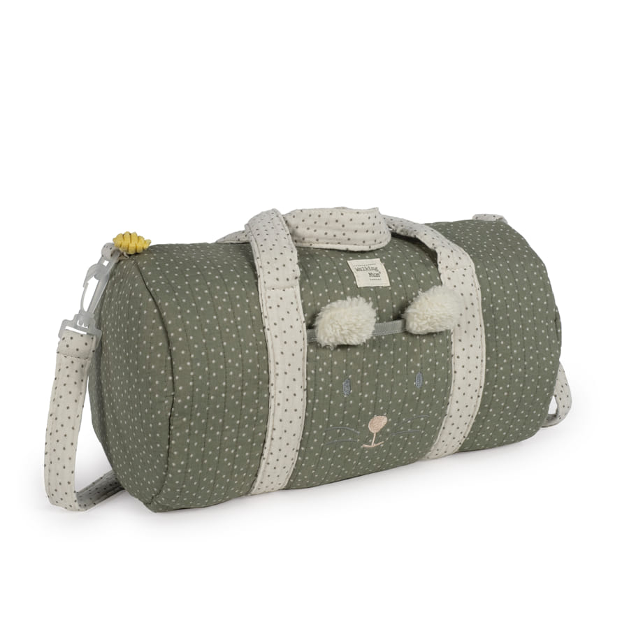 Mala saco verde com padrão de pontos e detalhes em forma de urso