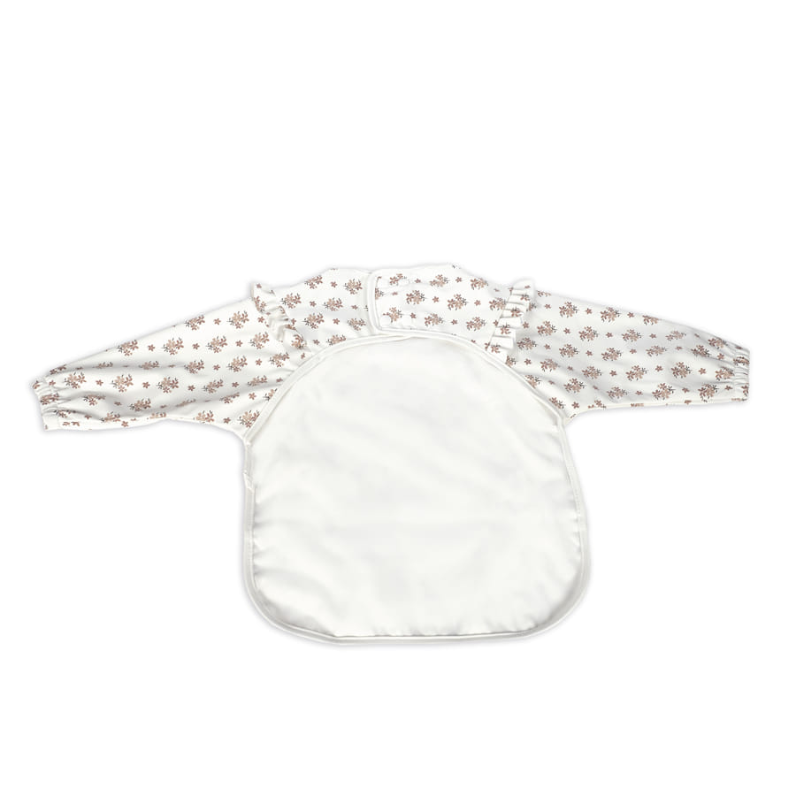 Babete com mangas compridas e padrão floral e frente branca