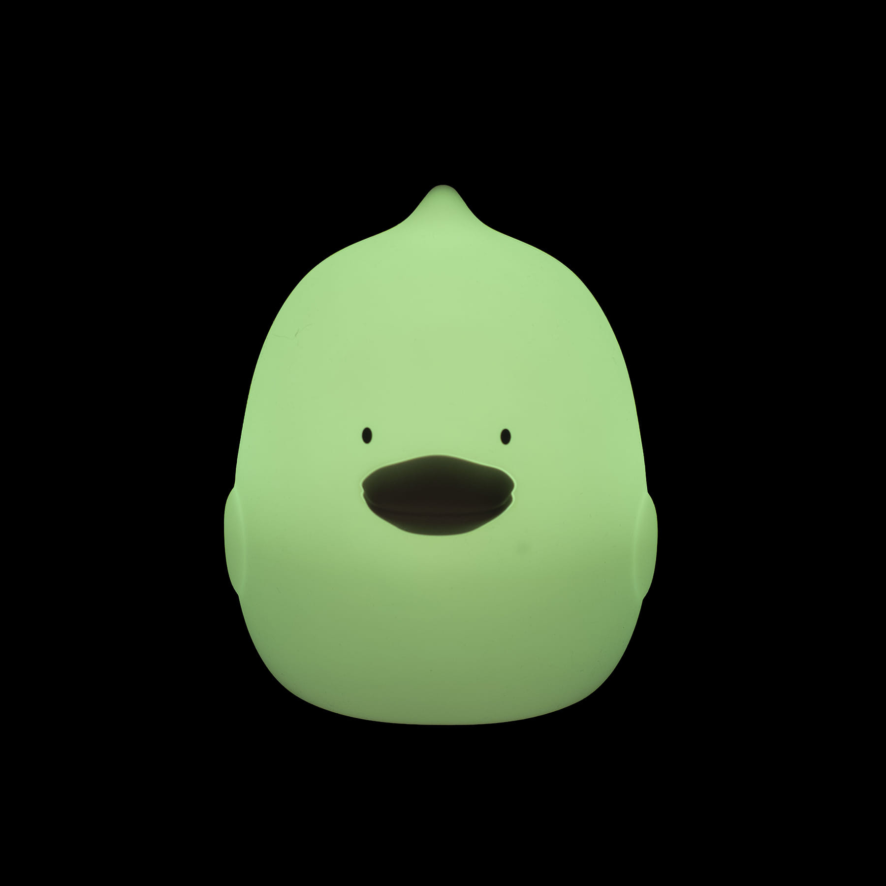 Pato de borracha verde fluorescente com olhos e bico pretos em fundo preto