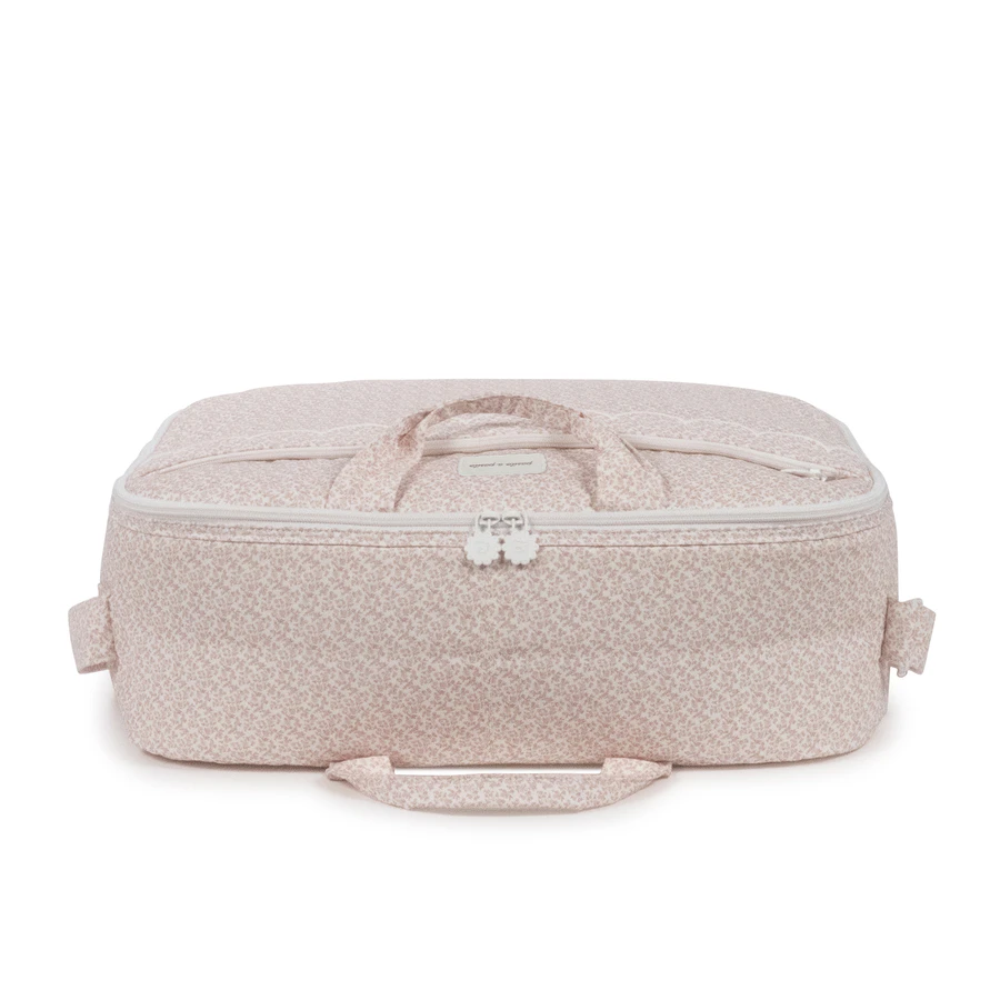 Mala de viagem rosa claro com padrão floral e fecho branco