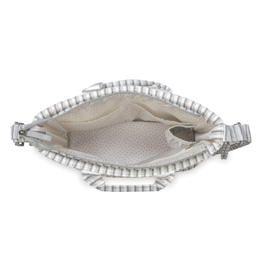 Mala de mão cinzenta e branca com interior bege e pontos castanhos vista de cima aberta