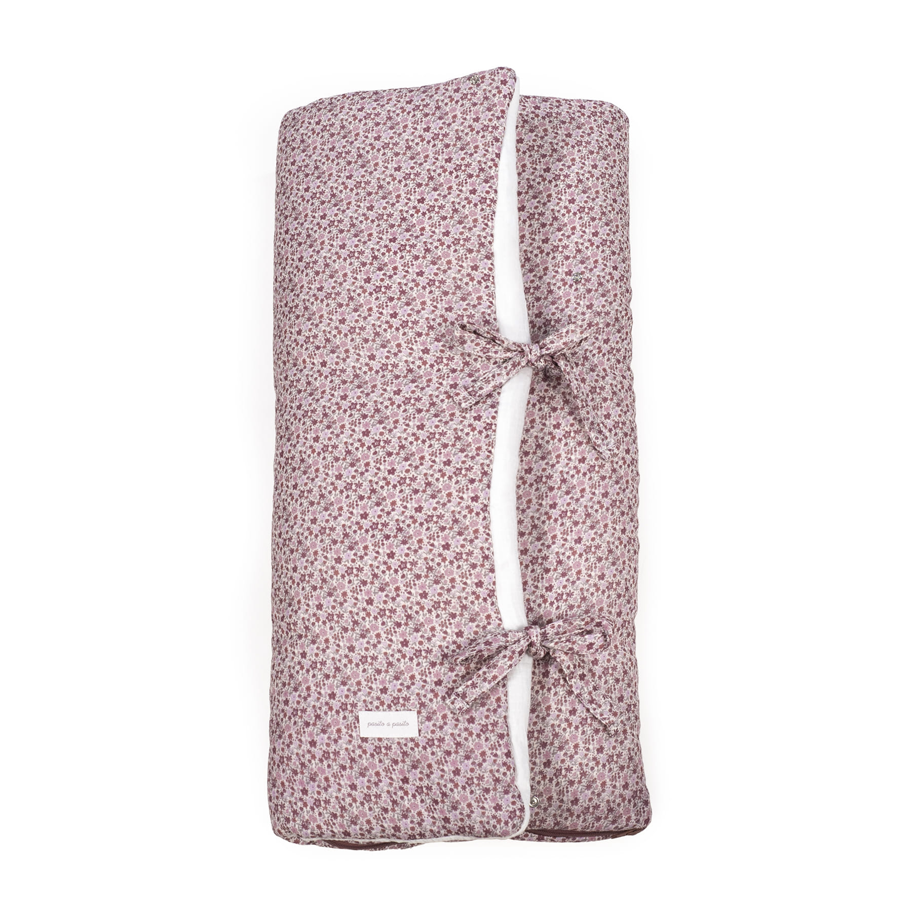 Cobertor rosa com padrão floral e laços