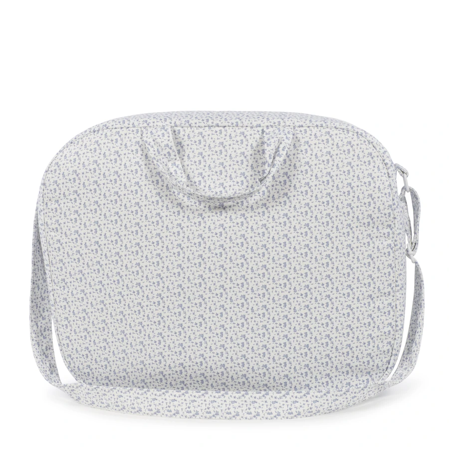 Bolsa de viagem branca com padrão floral azul claro