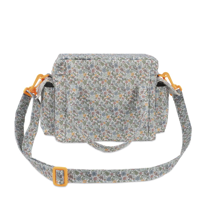 Mala de tecido floral com alça ajustável e detalhes amarelos