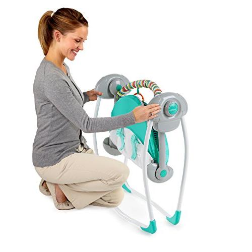 Cadeira baloiço para bebé com assento verde e barra de brinquedos