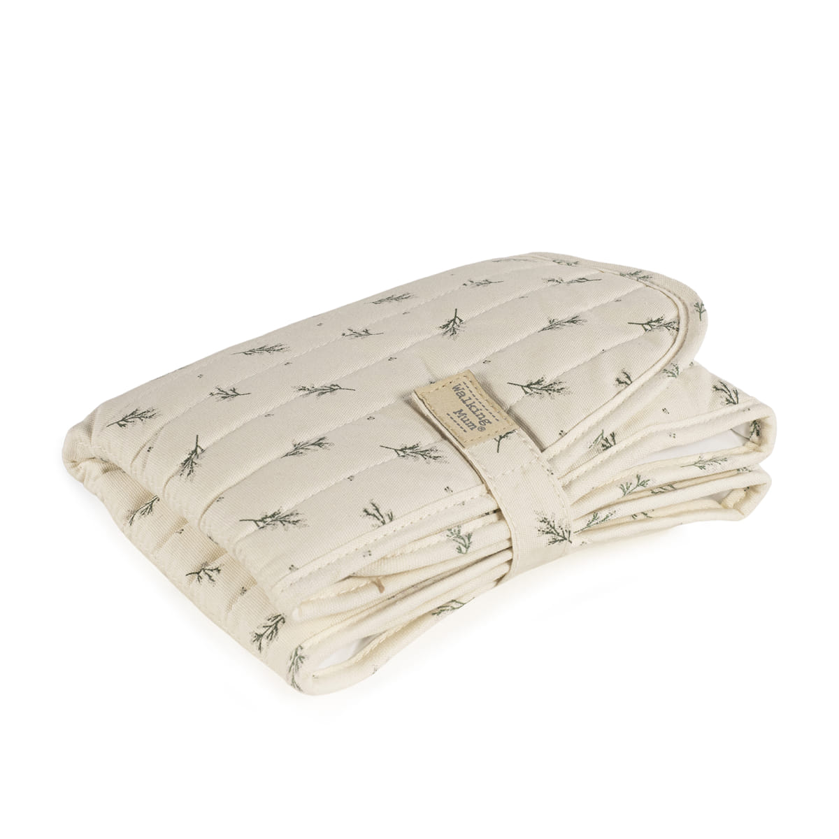 Almofada ou cobertor dobrado com padrão de ramos verdes