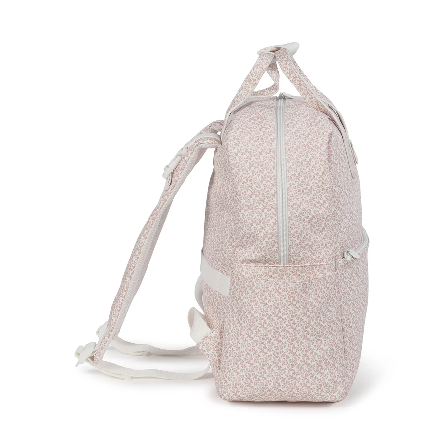Mochila rosa claro com padrão floral branco e fecho de correr