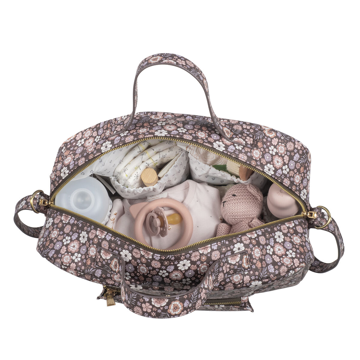 Mala de maternidade floral aberta com acessórios de bebé visíveis
