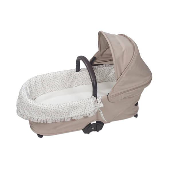 Cama de bebé portátil bege com interior almofadado floral e pega castanha