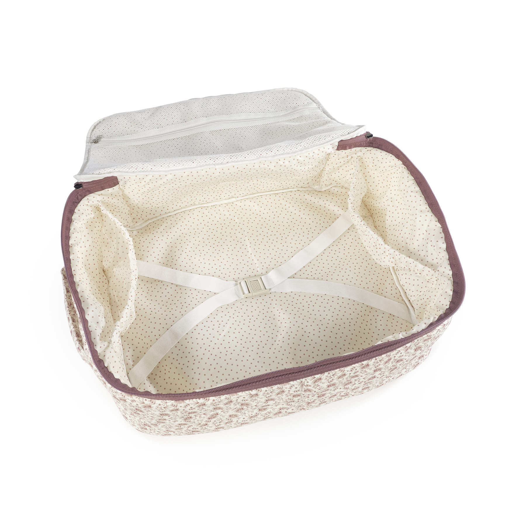 Mala aberta com padrão floral castanho e interior creme com bolinhas castanhas.