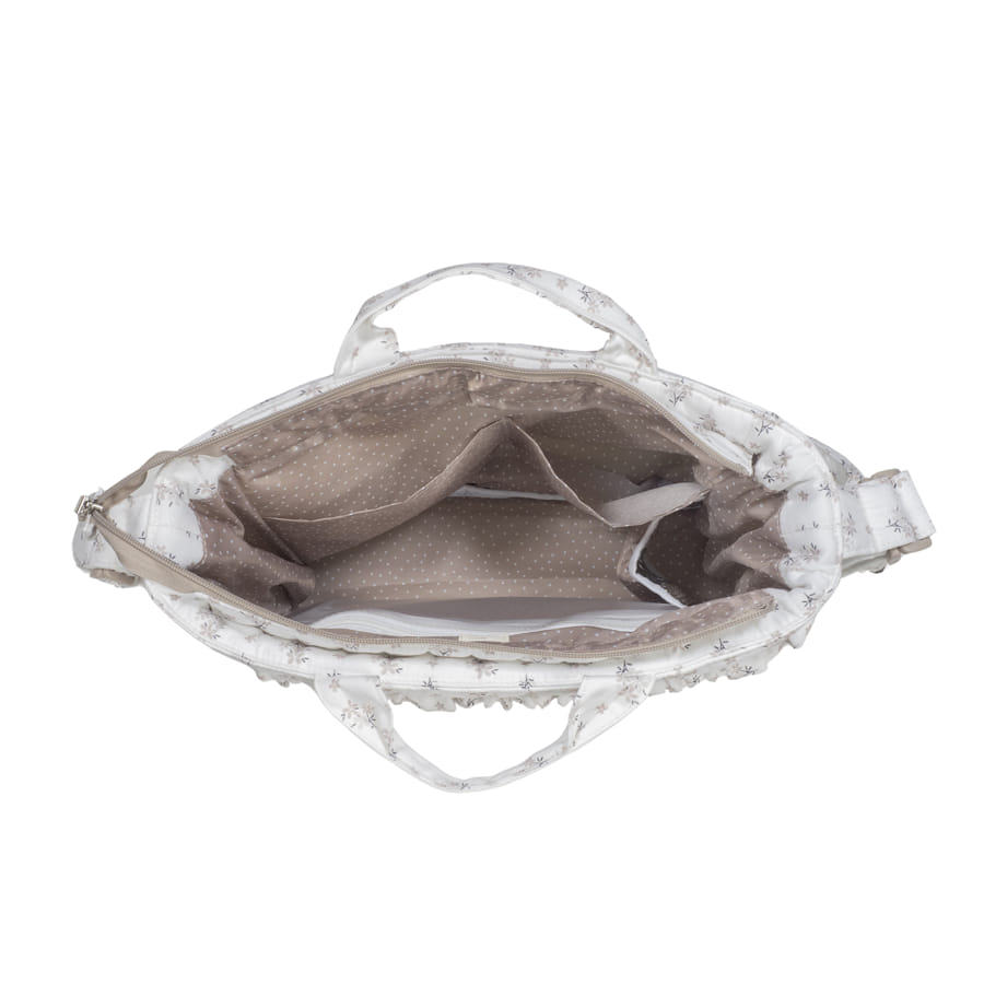 Mala branca com padrão floral e interior bege com bolinhas, vista de cima aberta