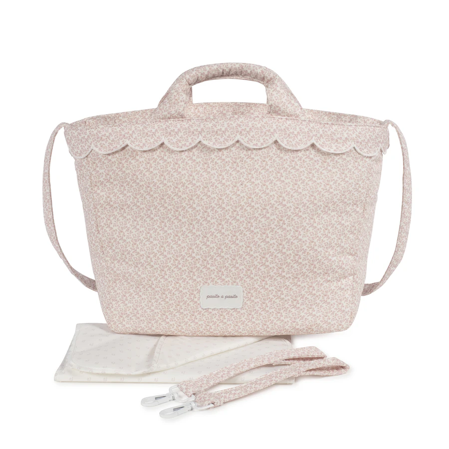 Bolsa de bebé rosa claro com padrão floral pequeno e alça