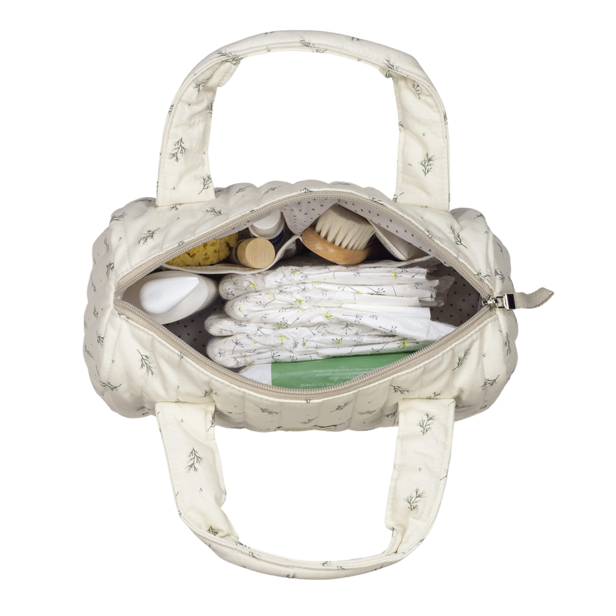 Bolsa bege claro estampada com folhas contendo acessórios de higiene