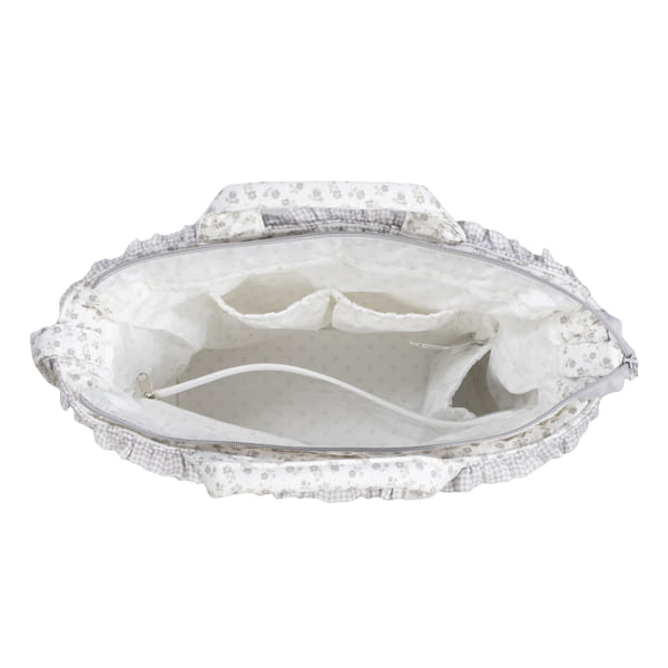 Bolsa de tecido floral aberta que mostra interior com bolsos.