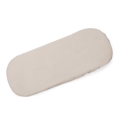 Colchão oval bege claro para bebê