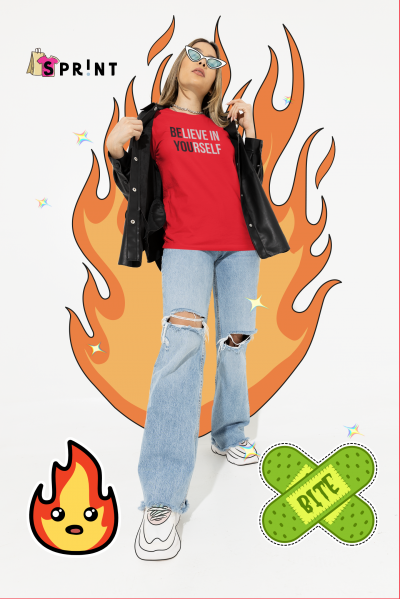 Mulher com t-shirt vermelha BE LIEVE IN YOURSELF, camisa preta, calças de ganga rasgadas e sapatilhas brancas sobre fundo com fogo e penso verde BITE.
