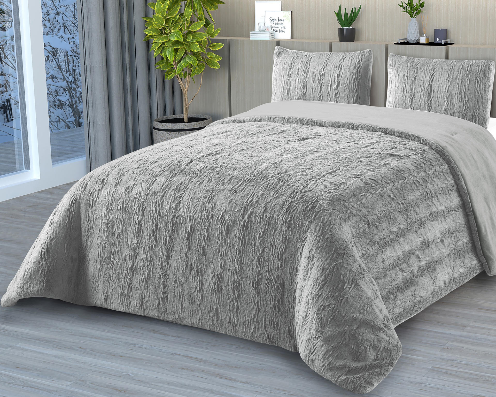 Cobertor e almofadas cinzentas com textura aveludada em cama moderna