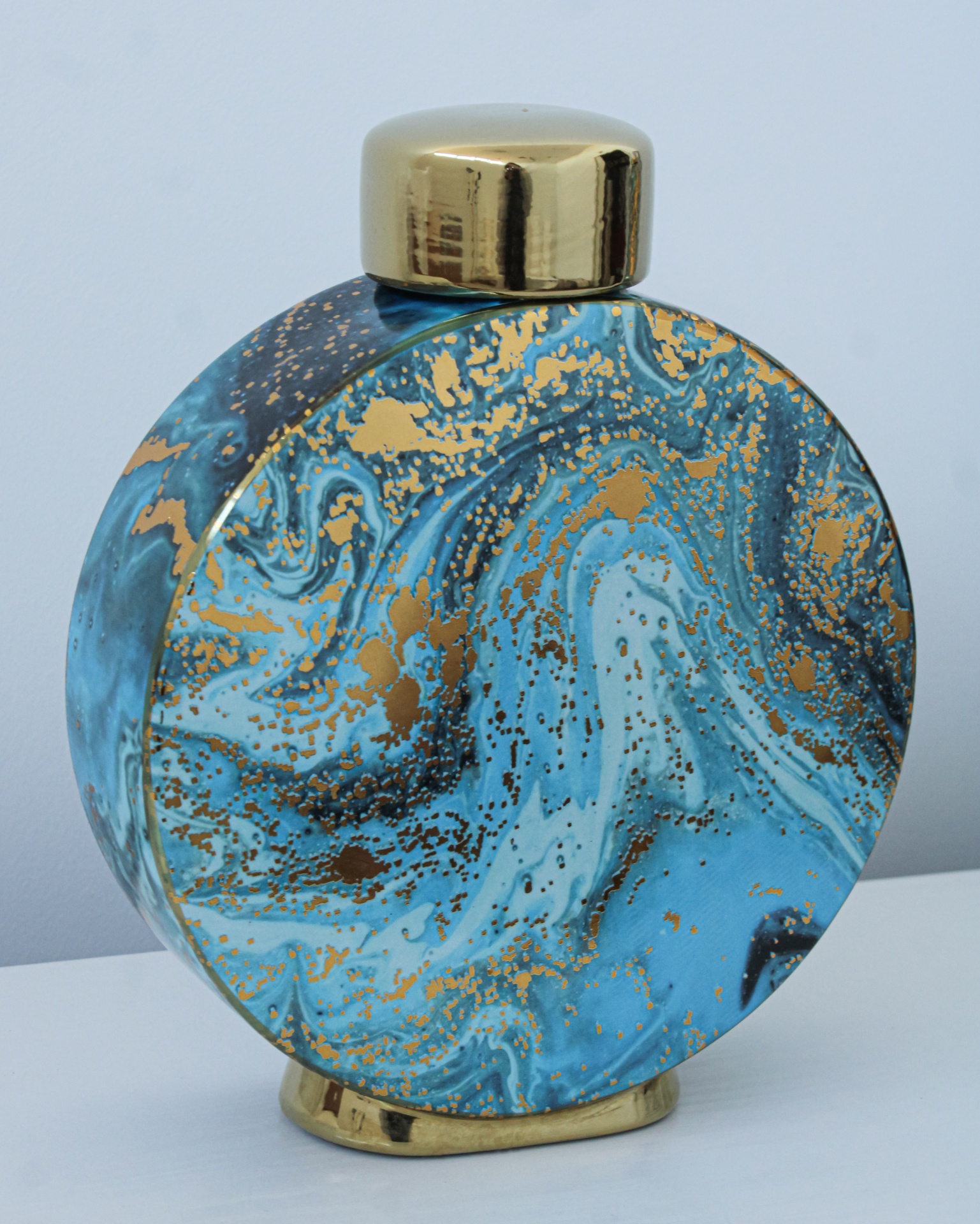 Frasco redondo decorativo com padrão marmoreado azul e dourado